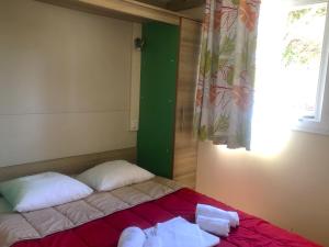 Llit o llits en una habitació de Camping Dolce Vita