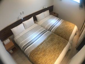 Una cama o camas en una habitación de Niruyakanaya BISE - Vacation STAY 58525v