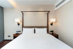 SSAW Boutique Hotel Foshan Qiandeng Lake 객실 침대