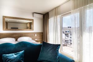 Tempat tidur dalam kamar di Sleep Inn Düsseldorf