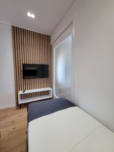 Ліжко або ліжка в номері Jani Studio Apartments