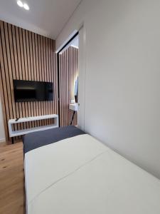 Ліжко або ліжка в номері Jani Studio Apartments