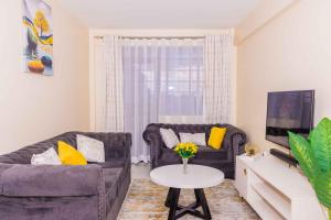 Predel za sedenje v nastanitvi Urban Suites, 2 bedrooms, Nanyuki