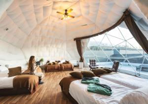 เตียงในห้องที่ VISION GLAMPING Resort & Spa 山中湖