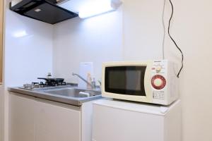 A cozinha ou cozinha compacta de Daiichi Mitsumi Corporation - Vacation STAY 15270