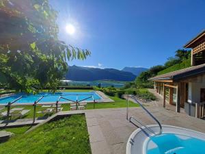 a view of a swimming pool from a house at Pension Hasslhof in Caldaro