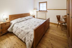 Voodi või voodid majutusasutuse Villa Lacedel - Stayincortina toas