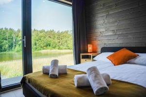 Voodi või voodid majutusasutuse Ruciane Park - Mazury resort & spa toas