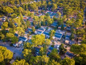 an overhead view of a school yard with houses at Mobile homes in Zaton Holiday Resort, with large pool area in Zaton