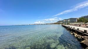 a view of the ocean from a pier at Luxury Sea View Apartment in Vlorë