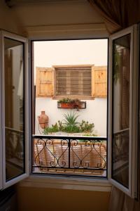 A balcony or terrace at VICTORIA BOUTIQUE HOTEL