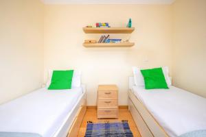 Una cama o camas en una habitación de GuestReady - Caravelas Getaway