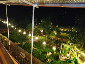 a view of a garden at night with lights at Muong Hoa Hmong Homestay in Sa Pa