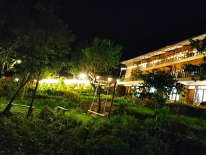 a playground in front of a building at night at Muong Hoa Hmong Homestay in Sa Pa