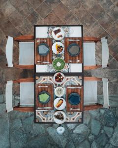 an overhead view of a table with plates of food at Bratsera Boutique Hotel in Hydra