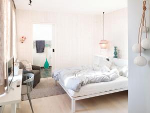 Tempat tidur dalam kamar di Inselloft Norderney