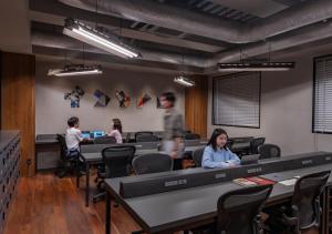 a group of people working in an office at The Millennials Kyoto in Kyoto