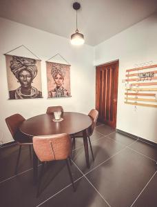 a dining room with a wooden table and chairs at Home Away One Bedroom Apartment in Nicosia in Nicosia