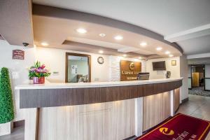 a lobby of a dental office with a reception counter at Clarion Inn Renton-Seattle in Renton