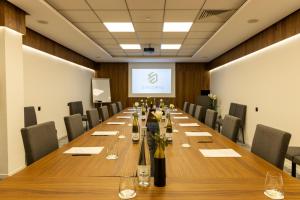 a conference room with a long table and chairs at DIAGONAL HOTEL in Tangier