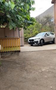 a silver car parked in front of a garage at Casa Doris in Vicuña