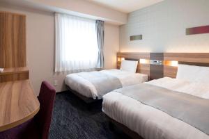 Кровать или кровати в номере Comfort Hotel Tokyo Higashi Kanda