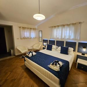 Кровать или кровати в номере Albis Rooms Guest House