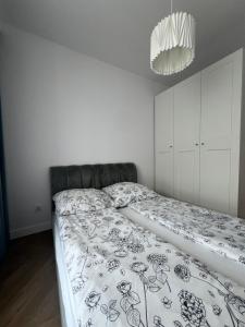 Vuode tai vuoteita majoituspaikassa Tani Nocleg Ełk - Apartament I love Ełk