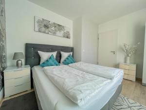 A bed or beds in a room at Relax Prémium Wellness Apartman