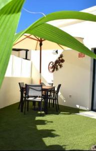 A garden outside Bungalow La Palmera - 2 bedroom - PLAYA ROCA residence sea front access - Pool View - Free AC - Wifi