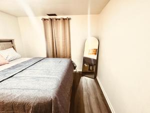 A bed or beds in a room at Cozy Muncie Home Near Downtown