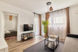 Elegantes 1 Zimmer Apartment Neubau Top Lage電視和／或娛樂中心