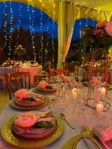 a table set up for a wedding with candles and flowers at Atlas Widan in Marrakech