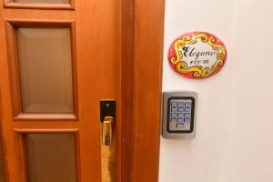 a door with a sign that says everyone is in at B&B Family in Torre del Greco