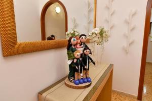 a statue of a family on a counter in a room at B&B Family in Torre del Greco