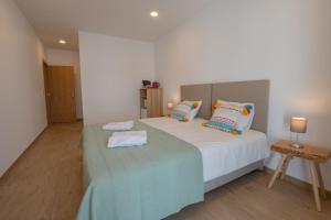 Cama ou camas em um quarto em Villa Harbour Rooms & Apartments