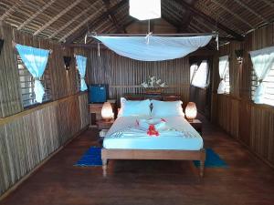 A bed or beds in a room at Doany Beach