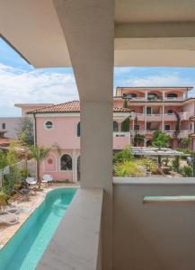 a view from the balcony of a building with a swimming pool at Casa Selimi in Ulcinj