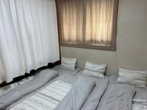 Katil atau katil-katil dalam bilik di Private Inn Bambee