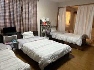 Katil atau katil-katil dalam bilik di Private Inn Bambee