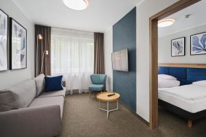 Krevet ili kreveti u jedinici u okviru objekta Hotel Halo Toruń