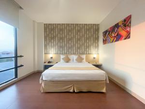 Hotel 88 Embong Malang Surabaya By WH房間的床