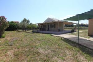 a house with a large yard in front of it at Olga Home Agios Ioannis Lefkada - Lefkada BnB in Lefkada Town