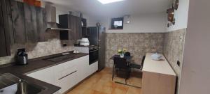 a kitchen with a sink and a table in it at Alexi cir 0009 in Chambave