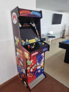 a video game arcade game machine in a room at Alcore Luxury Golf Villa at Alto Golf Alvor in Alvor