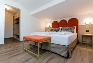 A bed or beds in a room at Hotel Sole - Sonne