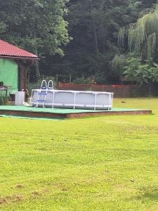 a small boat sitting in a field of grass at Rooms Ma La in Karlovac