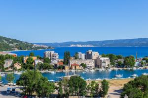 a view of a city with boats in a harbor at Skyline Suite in Omiš