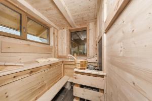 a wooden cabin with a tub and windows at Luxus-Appartement mit Whirlpool und Sauna #531 in Ainring