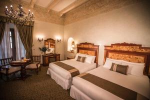 Posteľ alebo postele v izbe v ubytovaní Aranwa Cusco Boutique Hotel